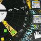 Much of the gameplay revolves around a turntable, which is the focal point of the board.